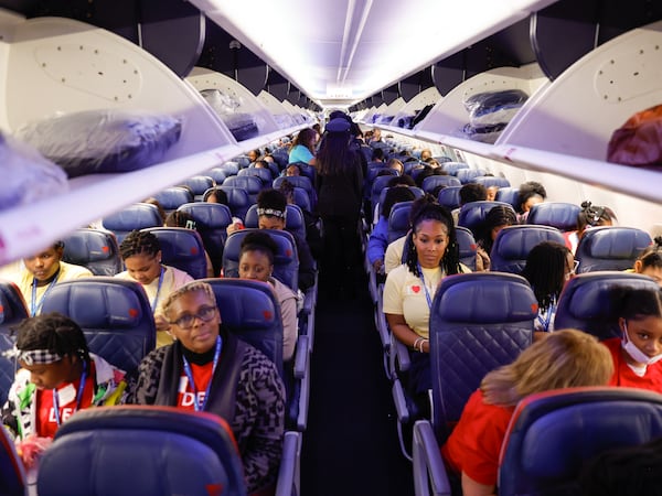 Students in Delta Airlines’ ‘Women Inspiring our Next Generation’ (WING) program, board their plane on Friday, Sept. 22, 2023. WING sponsors an an all-female charter flight that carries 100 young women interested in aviation from Atlanta to NASA’s Kennedy Space Center in Florida. (Natrice Miller/ Natrice.miller@ajc.com)