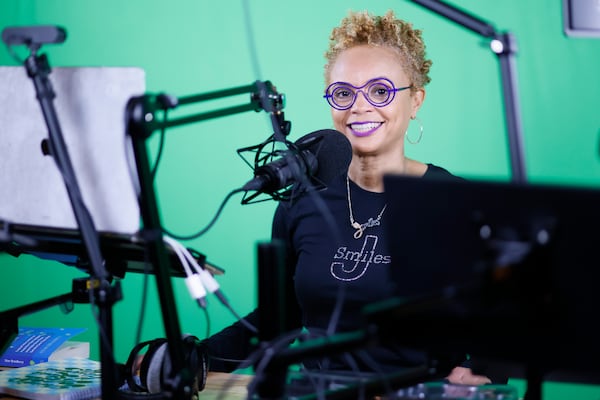 Stand-up comedian Janay Smith works at her studio in the basement of her Atlanta home with her podcast "Parenting Up." Janay inspires caregivers to find hope and resilience amidst the difficulties of fighting Alzheimer's.   
 Miguel Martinez /miguel.martinezjimenez@ajc.com