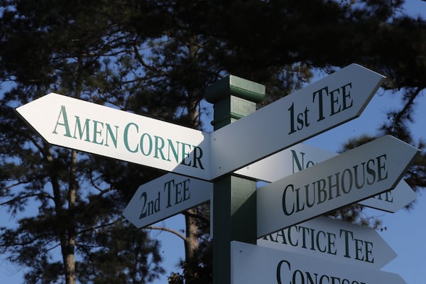 The morning light reflects off the sign pointing the way to Amen Corner  at Augusta National Golf Club in 2021. (Curtis Compton/AJC)