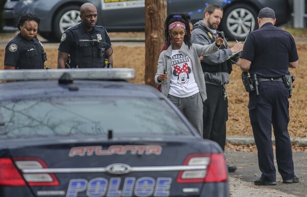 Atlanta police investigate the Jan. 17 dog attack that left Logan Braatz, 6, dead and Syari Sanders, 5, critically injured. On any given day, there are so many stray dogs that Fulton County animal control officers could easily remove 100 from the streets if they had the manpower, an official said. JOHN SPINK /JSPINK@AJC.COM