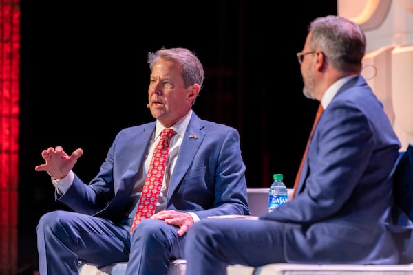 Gov. Brian Kemp speaks with Chamber of Commerce President Chris Clark at the chamber’s annual Eggs & Issues breakfast in Atlanta on Jan. 11, 2023. Kemp's inauguration for a second term is today. (Arvin Temkar/The Atlanta Journal-Constitution)