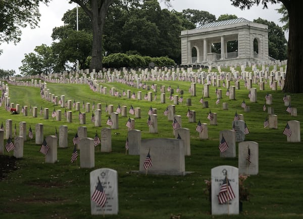 American flags are seen on front headstones at Marietta National Cemetery ahead Memorial Day, Saturday, May 26, 2018. Photo: BRANDEN CAMP/SPECIAL