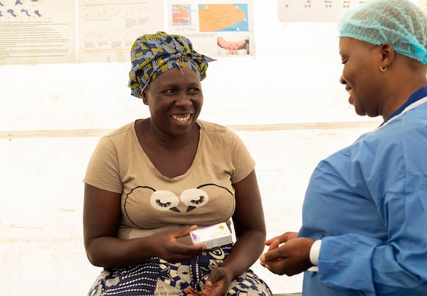 41 year old Catherine Tavaruva receives contraceptive pills at an outreach clinic in Epworth, Zimbabwe, Thursday, Nov. 14, 2024. (AP Photo/Aaron Ufumeli)