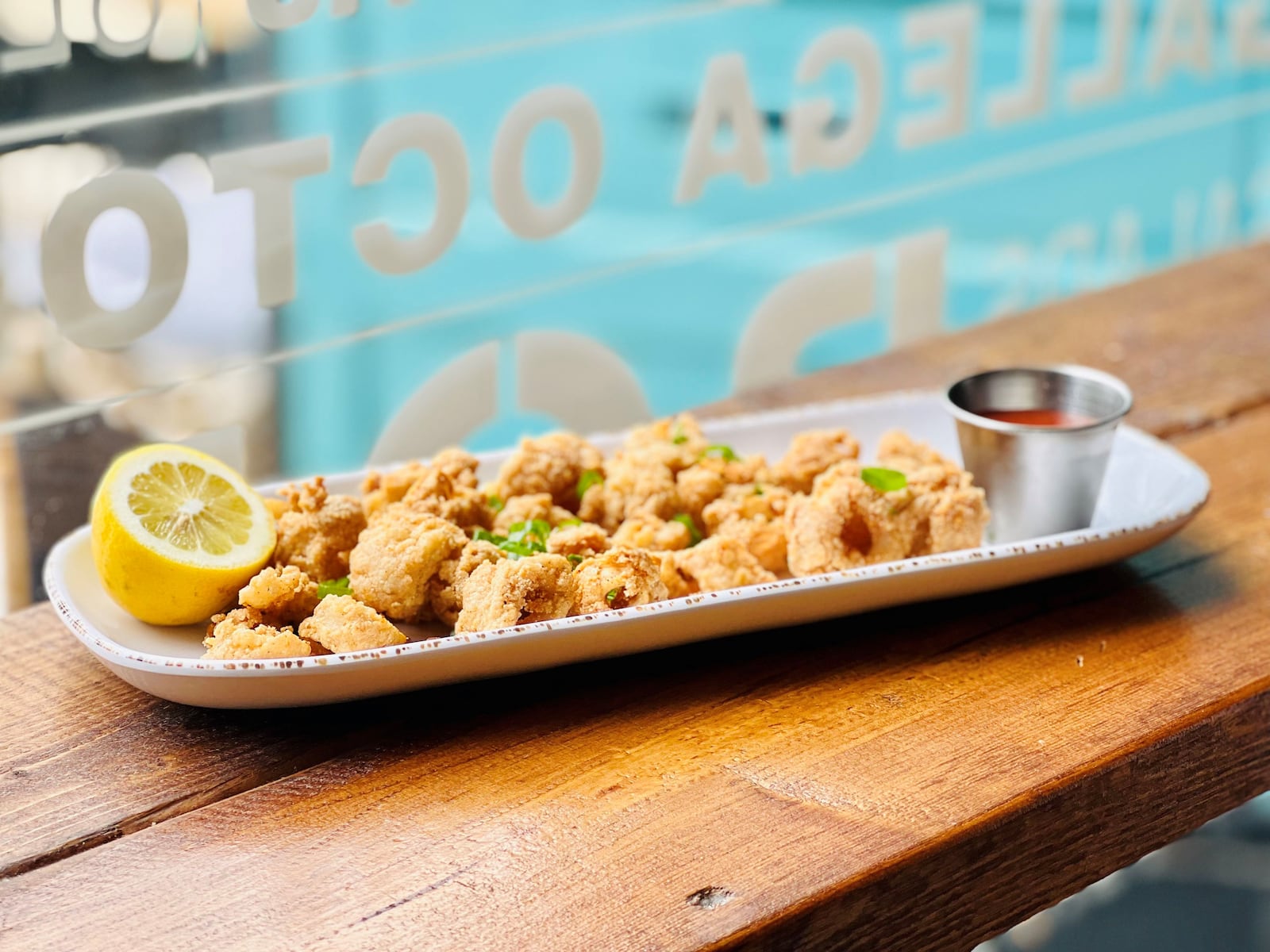 An order of fried calamari brings shatteringly crisp squid deliciously seasoned with extra shakes of black pepper, served with a kicked up remoulade. Photo by Liane St. Clair