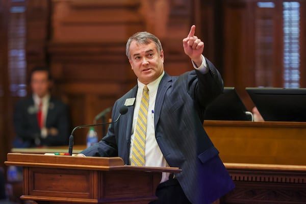 Georgia House Redistricting Chair Rob Leverett, R-Elberton, points to the voting board before the chamber approved a new map of its districts. Democrats saw six of their members paired up in three districts so only half of them have a chance of returning after the next election. (Jason Getz / Jason.Getz@ajc.com)