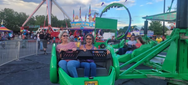 It looks as if one woman is having more fun than her friend at the North Georgia State Fair. 
(Courtesy of Missy Miller.)