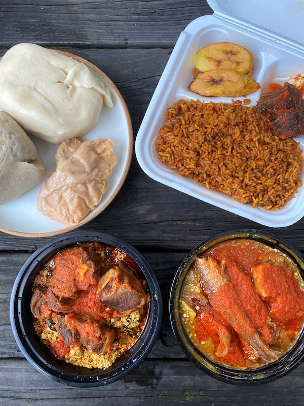 A takeout feast from Toyin: Clockwise from upper left: fufu, iyan, and moin moin; jollof rice with fried plantains and beef; okra stew with braised whiting and cow’s leg; egusi with beef and goat.
Wendell Brock for The Atlanta Journal-Constitution