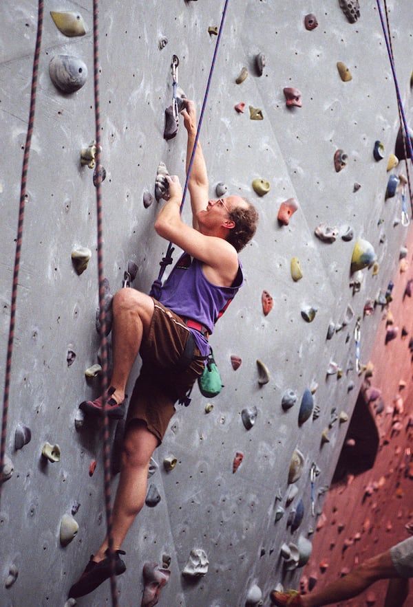 In this April 1999 file photo, Atlanta Rocks general manager Greg Perry is seen climbing at the Doraville indoor rock climbing gym.