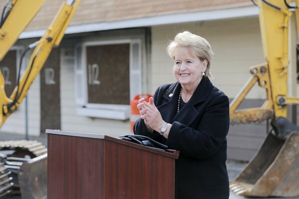 Jonesboro mayor Joy Brantley Day speaks before the demolition of buildings along Broad Street in downtown Jonesboro. The city is hoping to attract residents and visitors by upping its downtown revitalization efforts. They will start the process by tearing down a row of dilapidated buildings on Broad Street. ALYSSA POINTER/ALYSSA.POINTER@AJC.COM