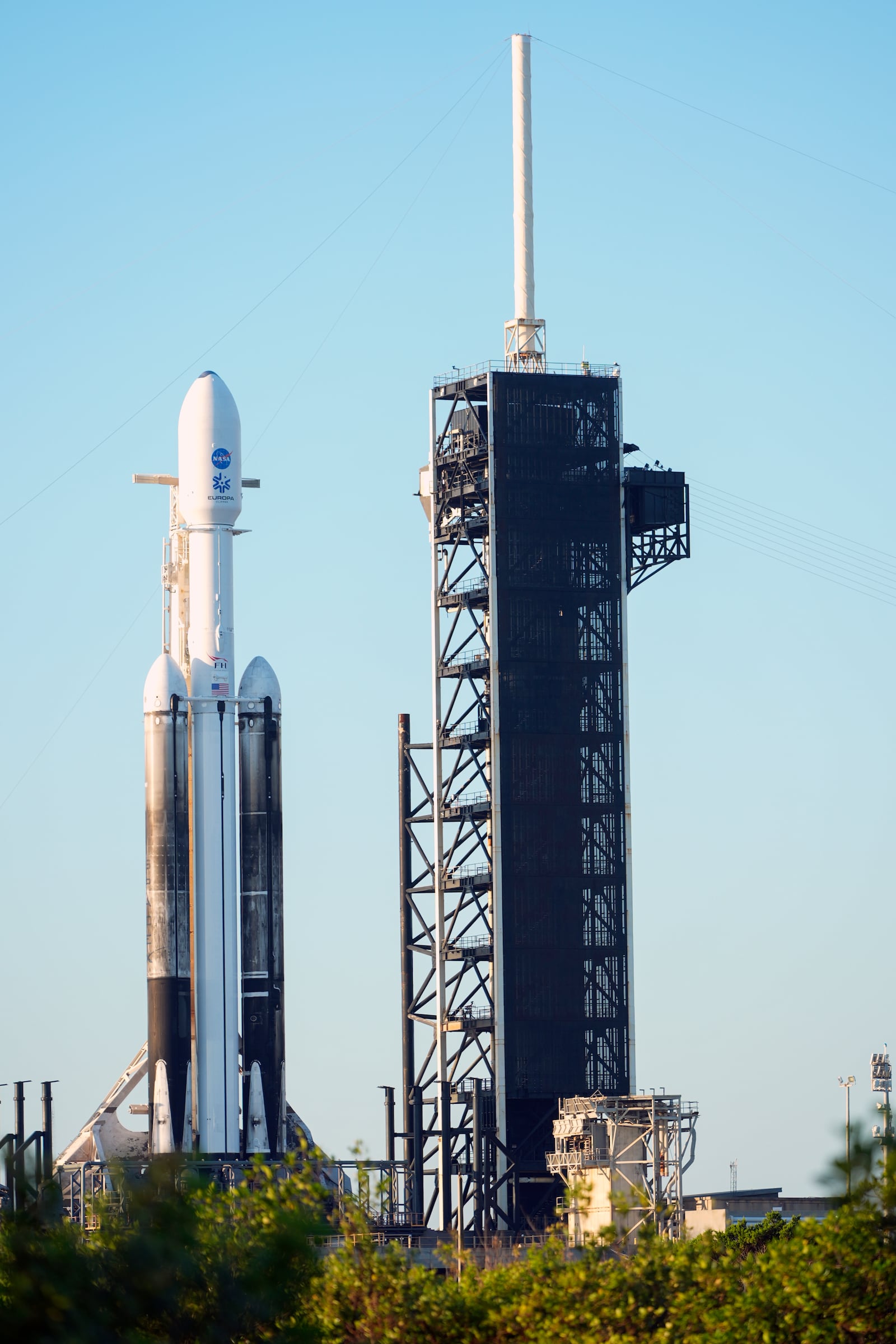 A SpaceX Falcon Heavy rocket with a NASA spacecraft bound for Jupiter stands ready for launch today on pad 39A at the Kennedy Space Center Monday, Oct. 14, 2024 in Cape Canaveral, Fla. (AP Photo/John Raoux)