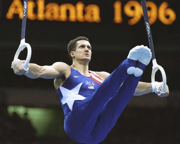 U.S. gymnast John Roethisberger competes on the rings during the men's team gymnastics event July 22, 2021, at the Georgia Dome in Atlanta. (Mike Powell /Allsport)