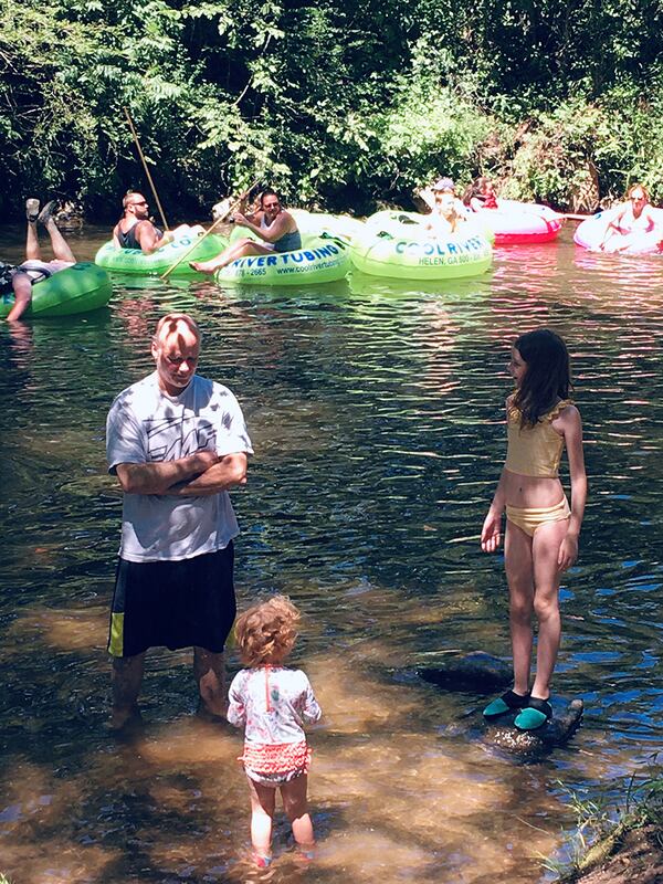 Jeff Matthews and his granddaughters Teagan Welch, 9, and Harper Welch, 2, cooled off in the Chattahoochee during their trip to Helen. Photo courtesy of Lori Matthews