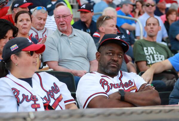 Braves fans in disbelief after the catastrophic first inning in Game 5 of the NLDS against the St. Louis Cardinals Oct. 9, 2019, at SunTrust Park in Atanta. 