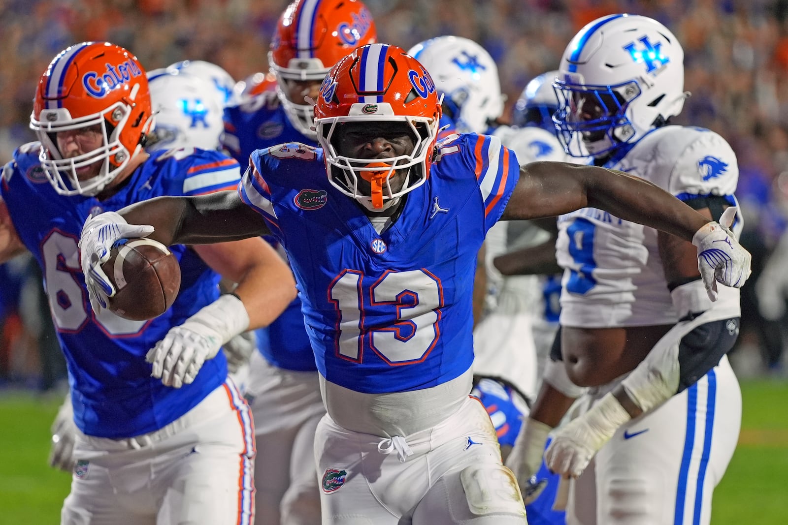 Florida running back Jadan Baugh (13) celebrates after a touchdown run against Kentucky during the first half of an NCAA college football game, Saturday, Oct. 19, 2024, in Gainesville, Fla. (AP Photo/John Raoux)