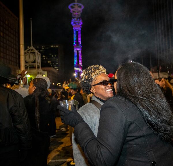 Jasmine Coley, left, and Tiara Coley during the fireworks after midnight. The Peach Drop returned to Underground Atlanta with a free concert including Big Boi as the headliner on Tuesday, Dec 31, 2024.  (Jenni Girtman for The Atlanta Journal-Constitution)