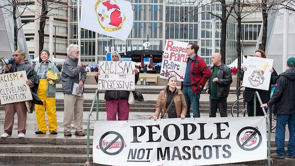 Protestors voice their opinion about Cleveland Indians mascot Chief Wahoo outside Progressive Field prior to the game between the Cleveland Indians and the Minnesota Twins on April 4, 2014 in Cleveland, Ohio. (Photo by Jason Miller/Getty Images)