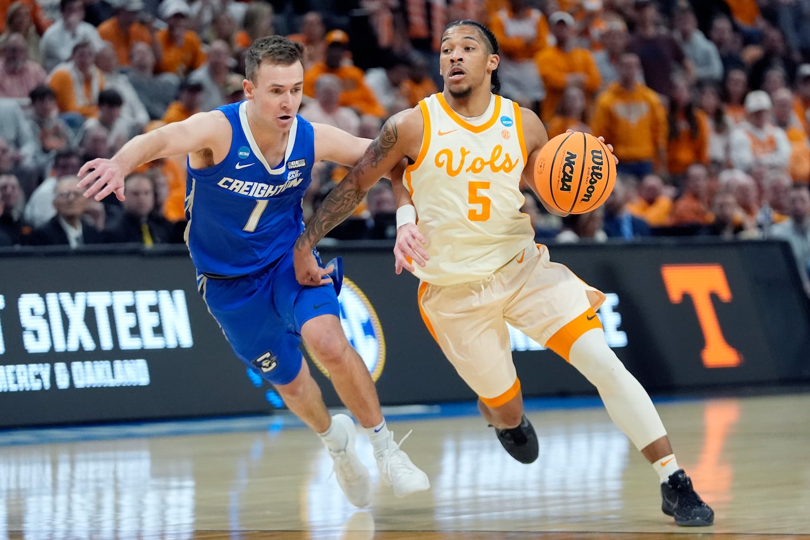 FILE - Tennessee guard Zakai Zeigler (5) drives as Creighton guard Steven Ashworth (1) defends during the first half of a Sweet 16 college basketball game in the NCAA Tournament, Friday, March 29, 2024, in Detroit. (AP Photo/Paul Sancya, File)