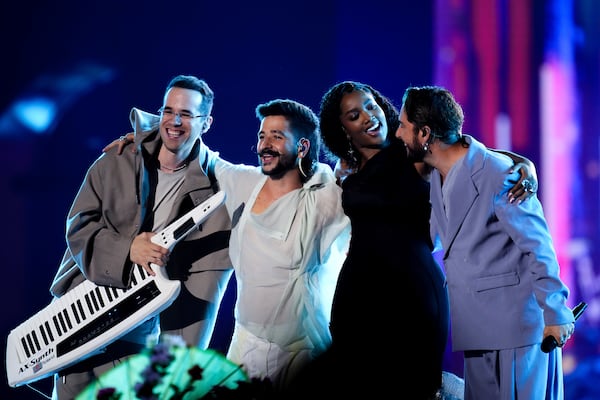 FILE - Producer and songwriter Edgar Barrera, from left, Camilo, IZA, and Manuel Carrasco perform during the 24th Annual Latin Grammy Awards, in Seville, Spain, Nov. 16, 2023. (Photo by Jose Breton/Invision/AP File)