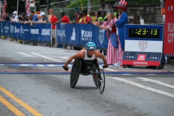 Susannah Scaroni wins the women’s wheelchair division of the 54th running of The Atlanta Journal-Constitution Peachtree Road Race in Atlanta on Tuesday, July 4, 2023.   (Hyosub Shin / Hyosub.Shin@ajc.com)