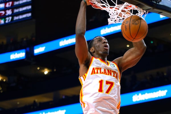 Atlanta Hawks forward Onyeka Okongwu dunks during the first half of the team's NBA basketball game against the Minnesota Timberwolves on Wednesday, Jan. 19, 2022, in Atlanta. (AP Photo/Hakim Wright Sr.)