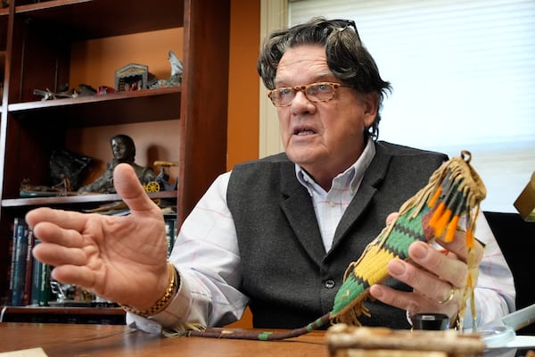 Kaja Veilleux gives his appraisal of an Native American antique at Thomaston Place Auction Galleries, Tuesday, Nov. 19, 2024, in Thomaston, Maine. (AP Photo/Robert F. Bukaty)