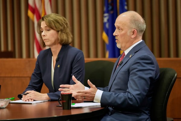 Wisconsin Supreme Court candidates Brad Schimel and Susan Crawford participate in a debate Wednesday, March 12, 2025, in Milwaukee. (AP Photo/Morry Gash)