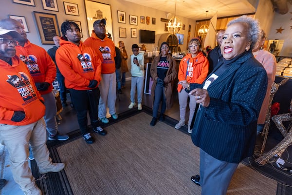 Elisabeth Omilami talks with the volunteers before they start loading onto a truck the 1200 hot meals Hosea Helps deliver to people around Atlanta on Thursday, November 23, 2023.  (Steve Schaefer/steve.schaefer@ajc.com)