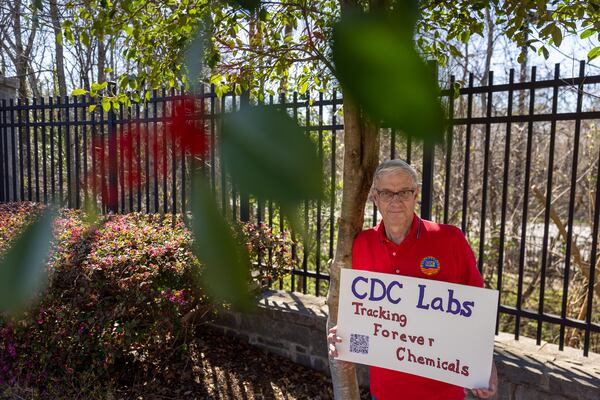 Retired CDC employee Steve Monroe protests against cuts to the agency in front of its Chamblee campus on Tuesday, March 18, 2025. (Arvin Temkar/AJC)