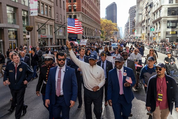 New York City Mayor Eric Adams marches in the annual Veterans Day Parade, Monday, Nov. 11, 2024, in New York. (AP Photo/Adam Gray)