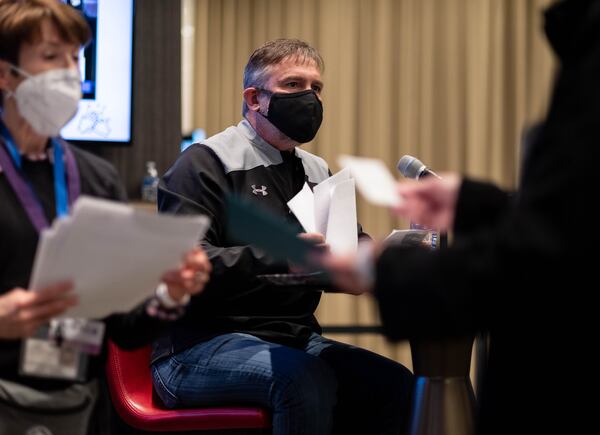 210116-Atlanta- Michael Looney, superintendent of Fulton County Schools, calls the names of school employees and their spouses to receive their COVID-19 vaccine Saturday morning, Jan. 16, 2021, at Mercedes-Benz Stadium. (Photo: Ben Gray for The Atlanta Journal-Constitution)