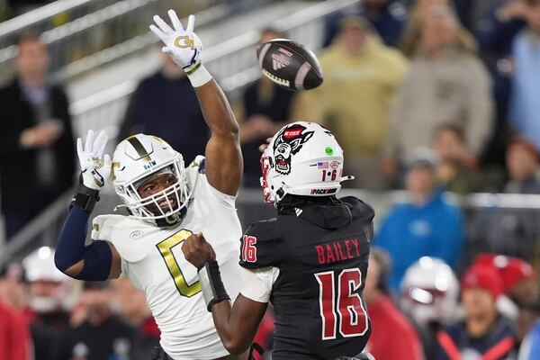 Georgia Tech linebacker Trenilyas Tatum (0) blocks a pass thrown by North Carolina State quarterback CJ Bailey (16) during the first half of an NCAA college football game, Thursday, Nov. 21, 2024, in Atlanta. (AP Photo/Brynn Anderson)