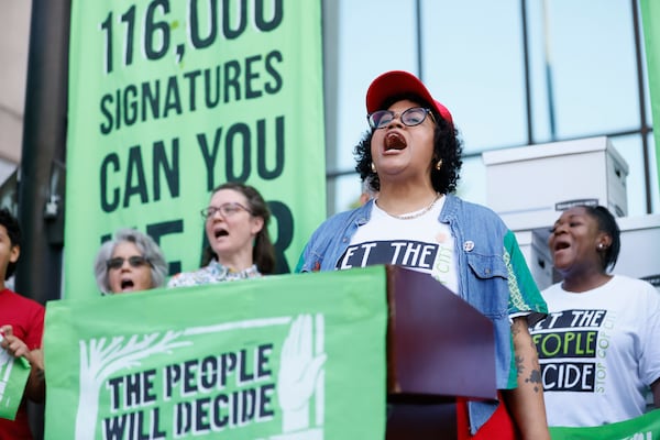 Aimee Castenell of the Working Families Party speaks during a press conference outside the Atlanta City Hall; opponents of Atlanta’s planned public safety training center intended to present their petition with 100,000 signatures to Atlanta on Monday, Sept. 10, 2023. (Miguel Martinez /miguel.martinezjimenez@ajc.com)