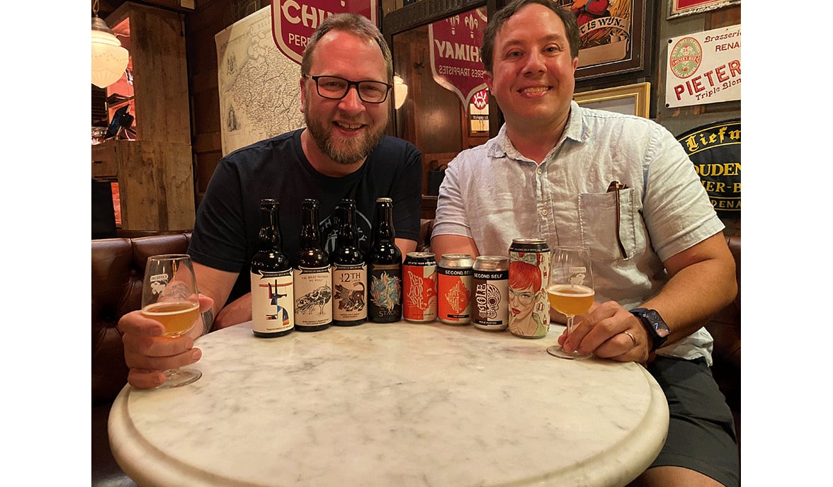 Orpheus Brewing’s Jason Pellet (left) and Second Self Beer Company’s Jason Santamaria having a chat with their beers at Brick Store Pub. /
Bob Townsend for the Atlanta Journal Constitution