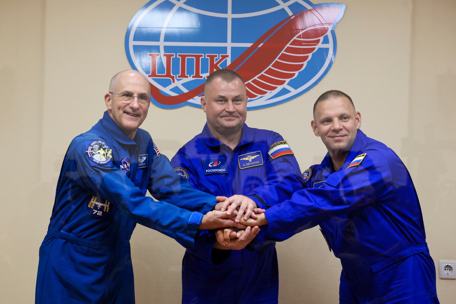 In this photo released by Roscosmos space corporation, NASA astronaut Don Pettit, left, Roscosmos cosmonauts Alexey Ovchinin, centre, and Ivan Vagner, crew members to the International Space Station, ISS, pose during a news conference on the eve of the launch in Russian leased Baikonur cosmodrome, Kazakhstan, Tuesday, Sept. 10, 2024. (Ivan Timoshenko, Roscosmos space corporation, via AP)