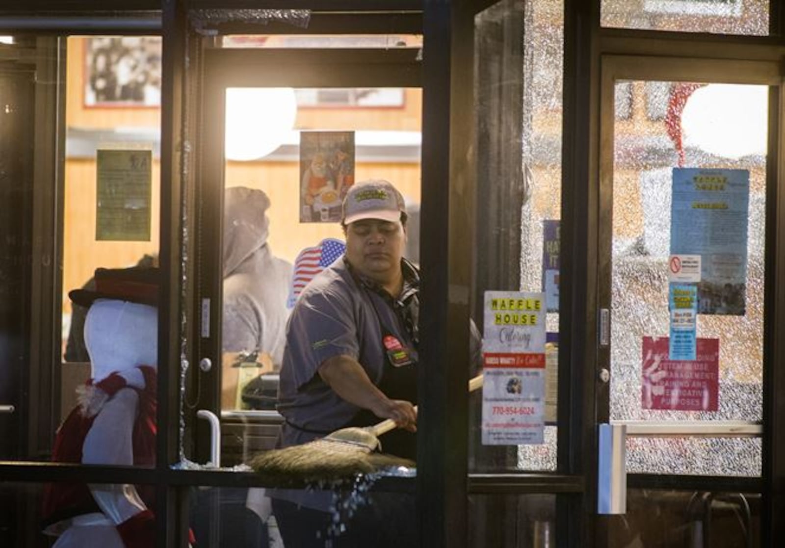 Cleanup efforts were underway Tuesday after a shooting injured local rapper Yung Mazi Tuesday at a Buckhead Waffle House. BRANDEN CAMP/SPECIAL