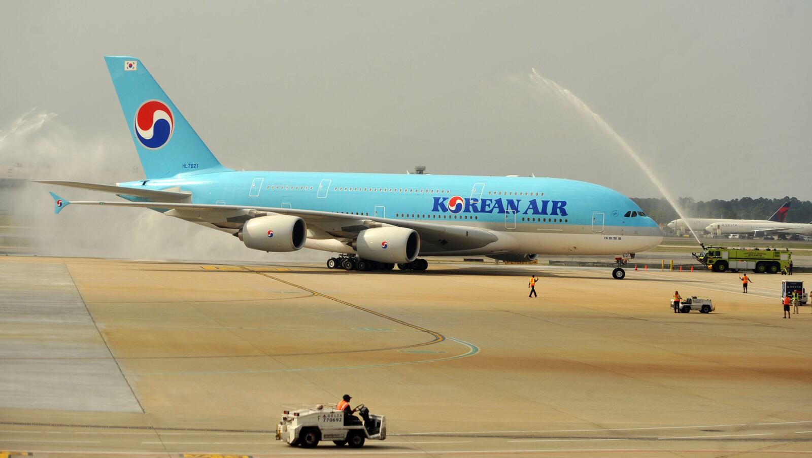 Korean Air’s 407-passenger Airbus A380, the world’s largest passenger aircraft, arrived in Atlanta September 6, 2013. For years, only Councourse E had gates large enough to accomodate the airplane. KENT D. JOHNSON / KDJOHNSON@AJC.COM