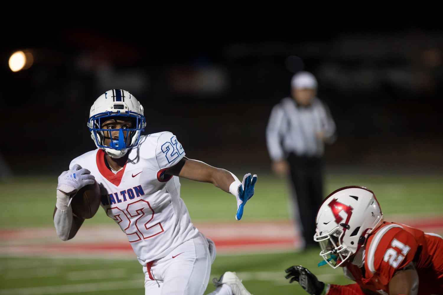 Walton's Braylen Stokes (22) runs the ball during a GHSA high school football playoff game between the Archer Tigers and the Walton Raiders at Archer High School in Lawrenceville, GA., on Friday, November 19, 2021. (Photo/Jenn Finch)