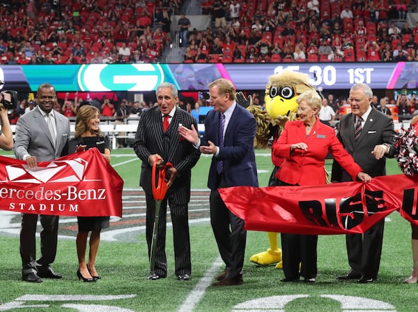  Atlanta, GA - Watched carefully by Freddie Falcon, Arthur Blank cuts the ribbon for the Falcons opener at Mercedes-Benz Stadium, with Atlanta Mayor Kasim Reed and Gov. Nathan Deal on Sept. 17.  The 50-yard line is where participants in Saturday’s 5K/Walk Like MADD event will finish. CURTIS COMPTON  / CCOMPTON@AJC.COM