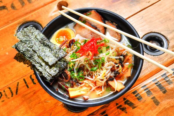 Lifting Noodles Ramen, featuring creamy pork broth, pork belly noodles, sweet corn, black mushroom, bamboo shoots, bean sprouts, scallions, sesame seeds, pickled ginger, marinated soft-boiled egg and roasted seaweed. CONTRIBUTED BY CHRIS HUNT PHOTOGRAPHY