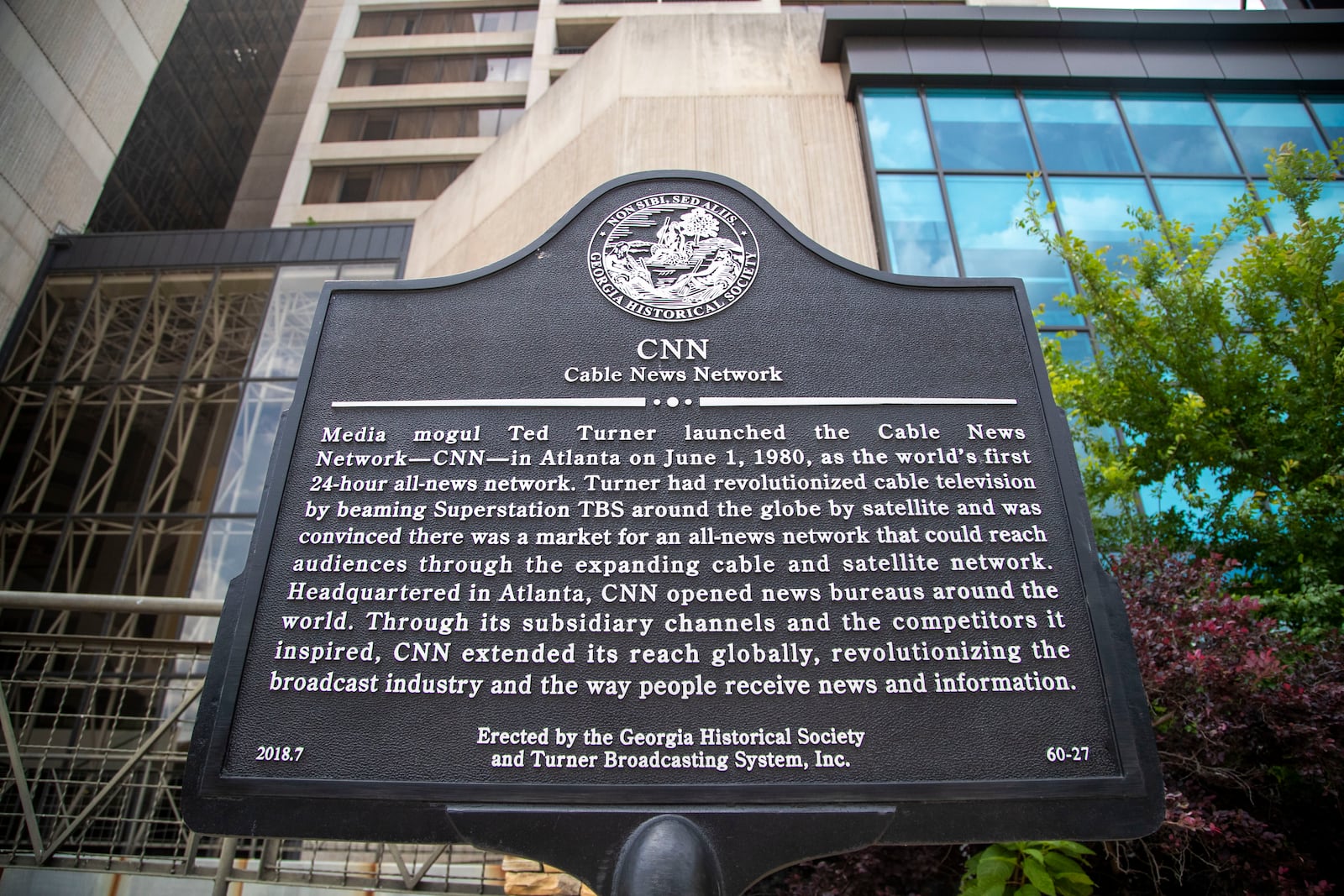 05/17/2021 — Atlanta, Georgia — A historical marker about the creation of CNN is displayed outside of the the former CNN Center Downtown. (Alyssa Pointer / Alyssa.Pointer@ajc.com)