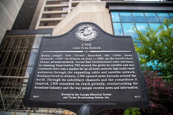 05/17/2021 — Atlanta, Georgia — A historical marker about the creation of CNN is displayed outside of the the former CNN Center Downtown. (Alyssa Pointer / Alyssa.Pointer@ajc.com)