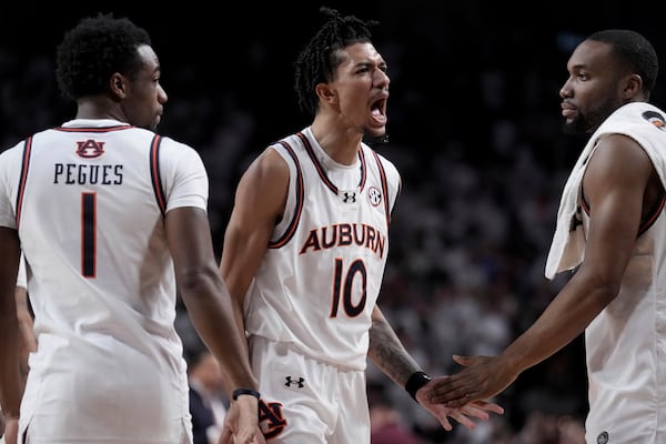 Auburn guard Chad Baker-Mazara (10) reacts after hitting a 3-point shot at the buzzer against Texas A&M to end the first half of an NCAA college basketball game, Tuesday, March 4, 2025, in College Station, Texas. (AP Photo/Sam Craft)