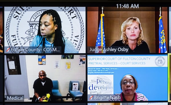 Braves outfielder Marcell Ozuna, bottom left, appears in Fulton County Magistrate Court via Zoom in front of Judge Ashley Osby, top right, on Monday morning. Osby granted him a $20,000 bond. Ozuna was arrested Saturday after Sandy Springs Police officers reported seeing him choke his wife, throw her against a wall and strike her with a cast. (Ben Gray for the Atlanta Journal-Constitution)