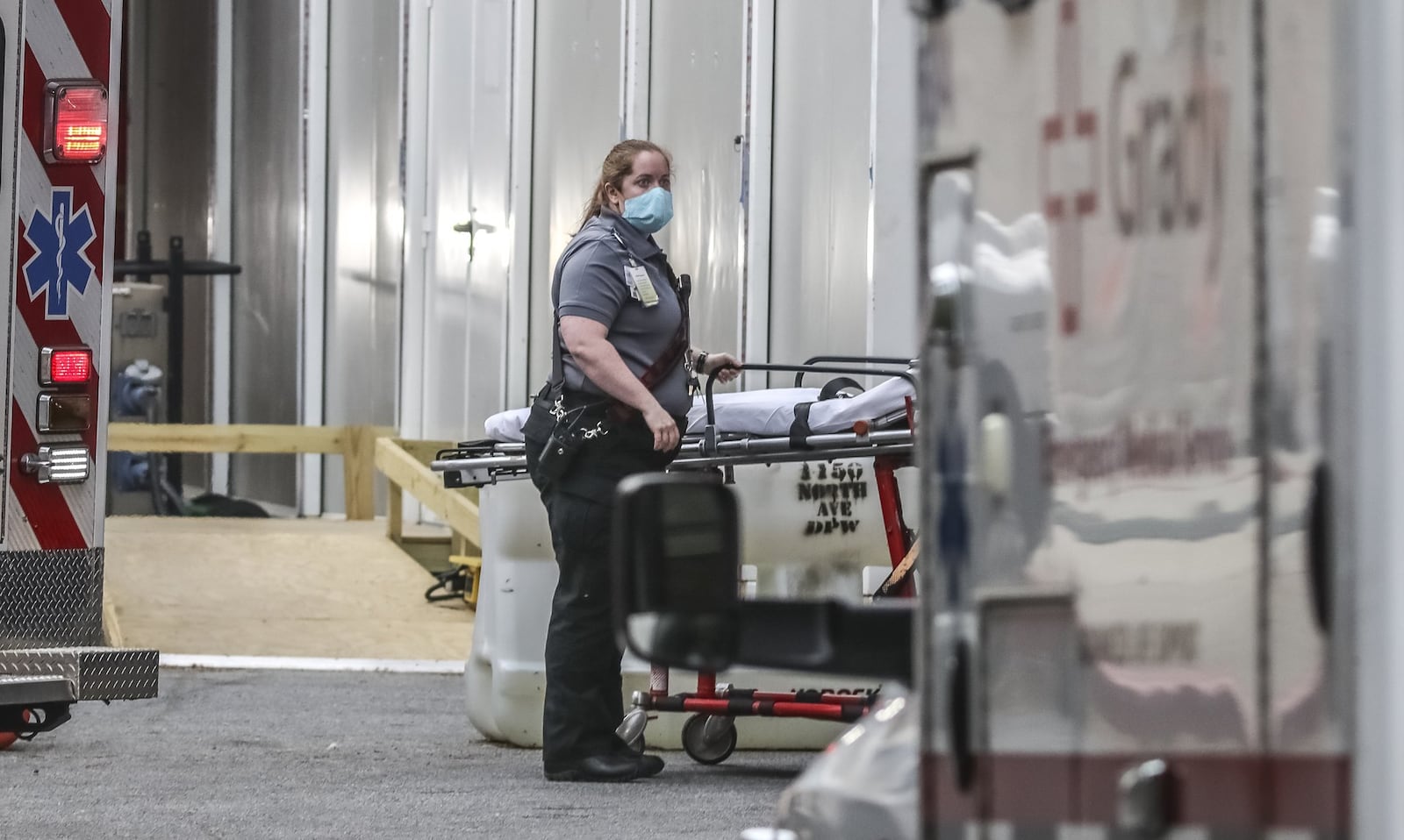 Mask-wearing Grady ambulance crews arrive at Grady Memorial Hospital in Atlanta on Tuesday, April 7, 2020. For the second day in a row, the number of deaths from the coronavirus in Georgia has risen sharply. With increased testing and rapid spread of the virus, numbers are expected to surge in the coming weeks. JOHN SPINK/JSPINK@AJC.COM