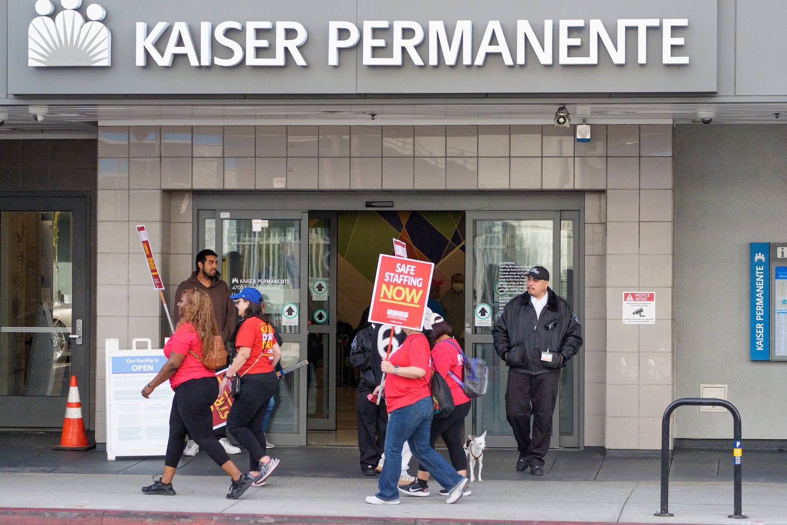 Mental health workers strike outside a Kaiser Permanente facility in Los Angeles Monday, Oct. 21, 2024. (AP Photo/Damian Dovarganes)