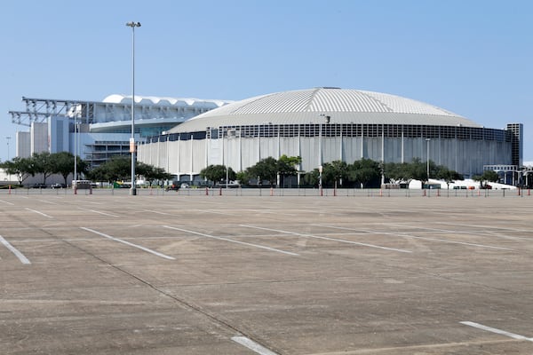 A view looking west of NRG Stadium, left, home to the Houston Texans NFL team, and the now dormant Astrodome, right, in the area now know as NRG Park Wednesday, Nov. 13, 2024, in Houston. The Astrodome Conservancy, a group dedicated to preserving the structure, has proposed a multi-use renovation for the once legendary building. (AP Photo/Michael Wyke)