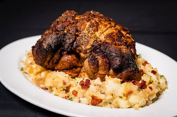 Brad Parker, executive chef of Dantanna’s Buckhead, prepared this Schweinebrate. He suggests using a Bavarian marzen beer in the braising liquid. Here it’s shown with German potato salad. STYLING BY BRAD PARKER / CONTRIBUTED BY HENRI HOLLIS