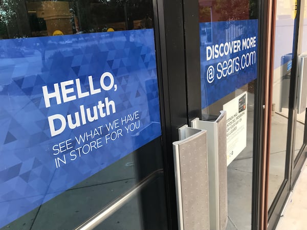 Signs on the door to one entrance at the soon-to-be-closed Sears store at Gwinnett Place Mall in Duluth. TYLER ESTEP / TYLER.ESTEP@AJC.COM