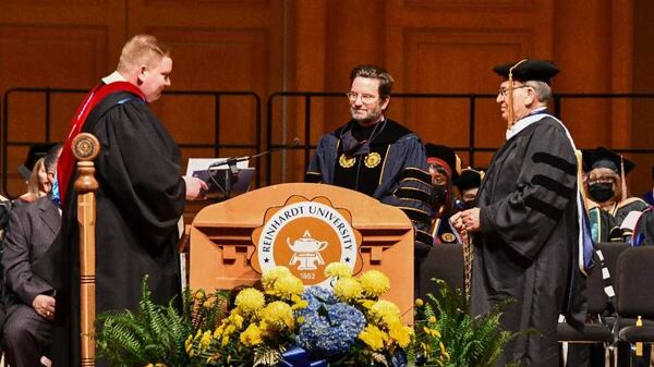 The Rev. Brian Smith, pastor of Waleska United Methodist Church (left); Reinhardt University President Mark A. Roberts (center), and C. Ken White, chair of Reinhardt's Board of Trustees, participate in Roberts' inauguration ceremony. (Contributed photo)