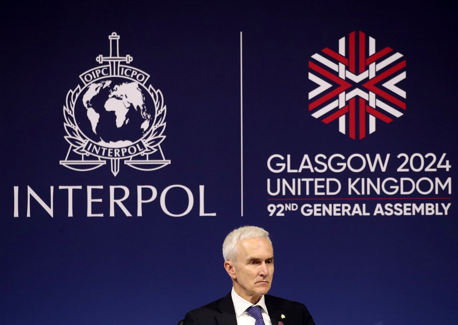 Juergen Stock Interpol secretary general speaks to the media at 92nd Interpol general assembly in Glasgow, Scotland, Monday, Nov. 4, 2024. (AP Photo/Scott Heppell)